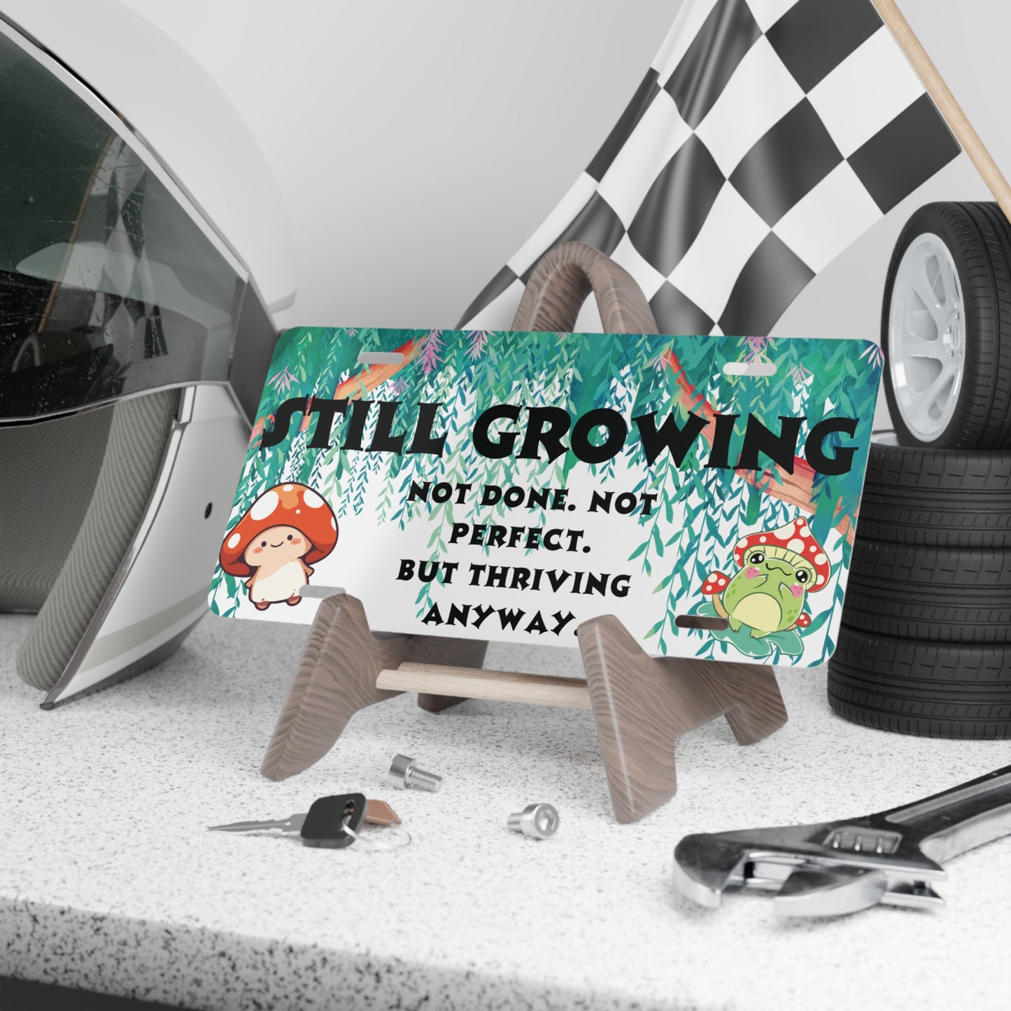 Still Growing Front License Plate – Whimsical Forest Affirmation with Frog & Mushroom Art